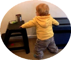 Baby moving from table to stool