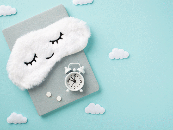 diary with alarm clock and sleeping clouds