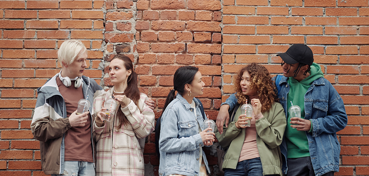 group of 5 teenagers talking