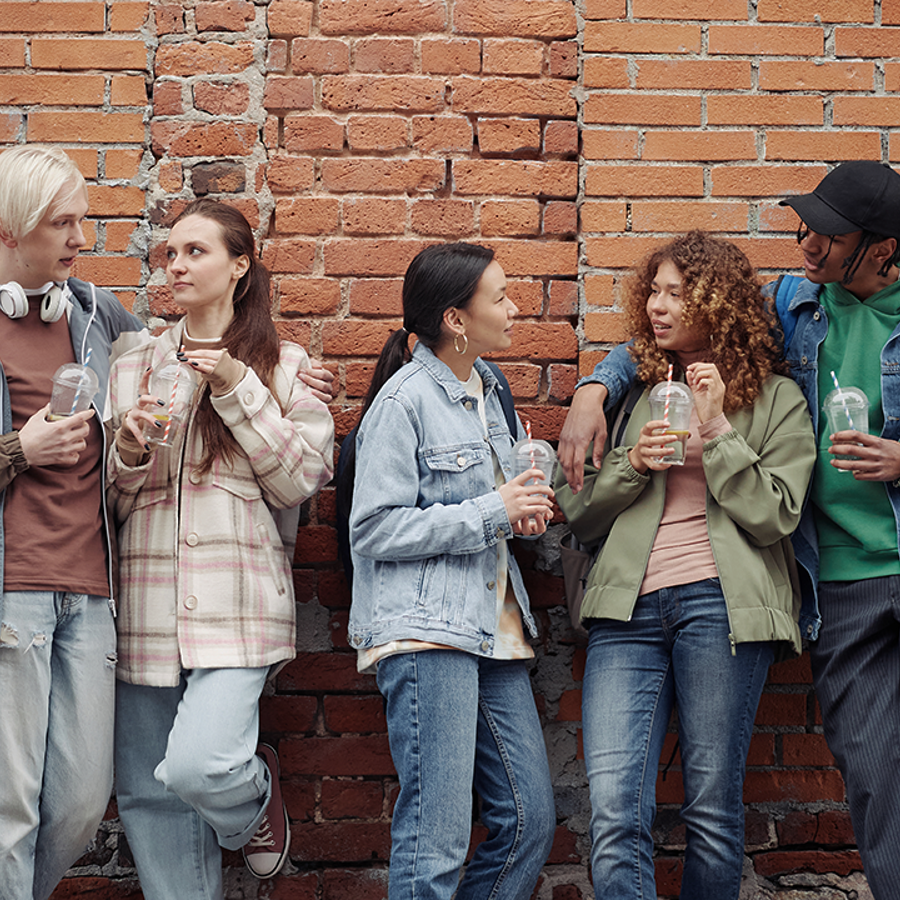 group of 5 teenagers talking