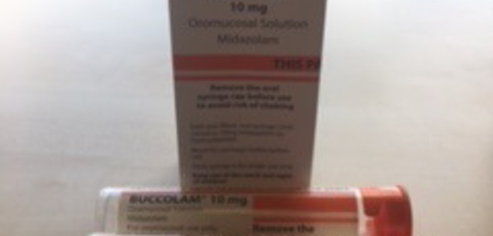 A box of Buccal Midazolam with two syringes placed in front