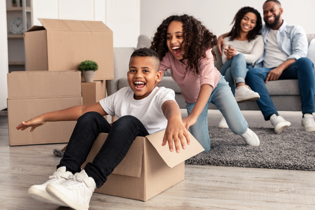 Family playing with cardboard boxes