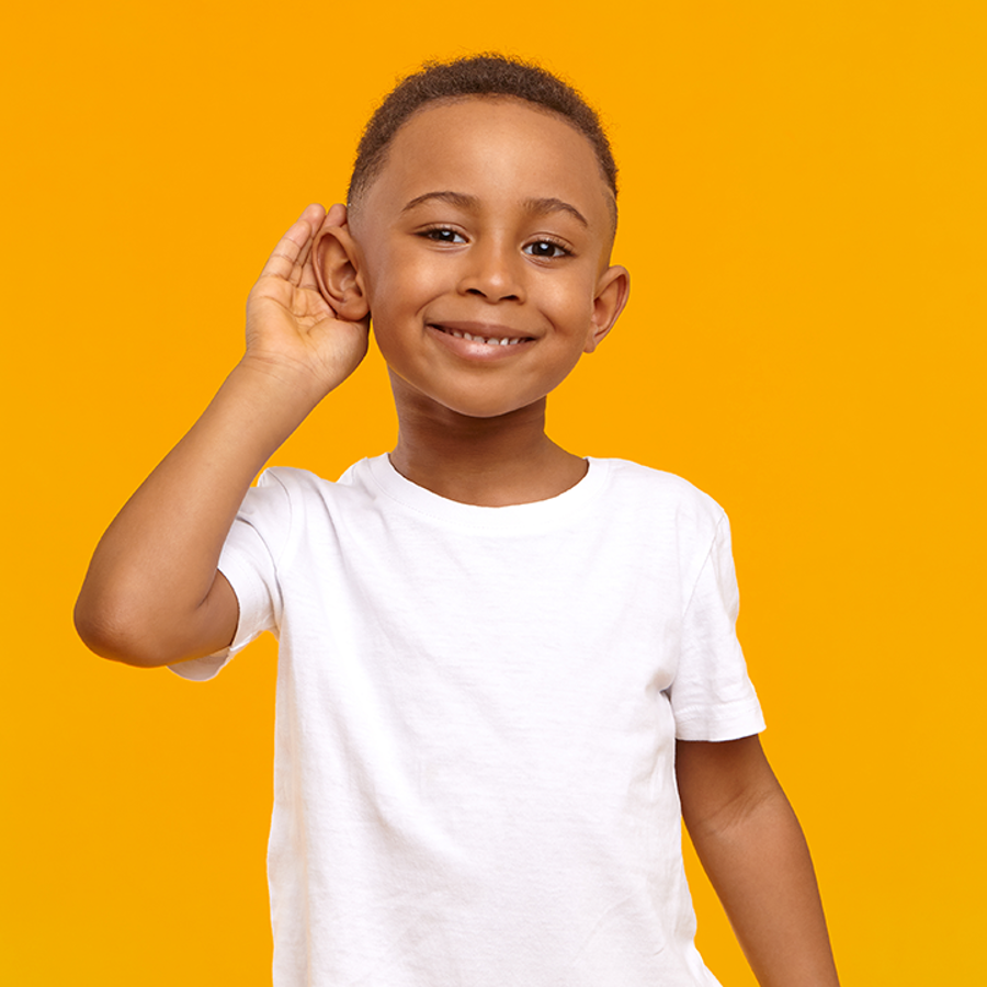 child holding ear in listening pose