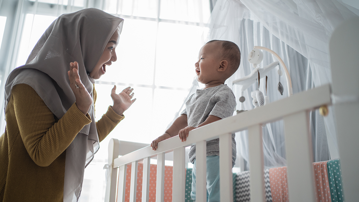 woman playing peek a boo with a child