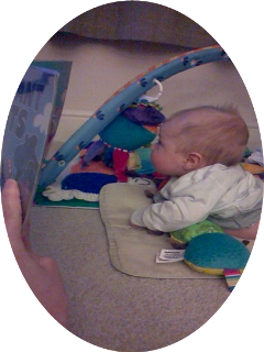 Baby on tummy in baby gym looking up