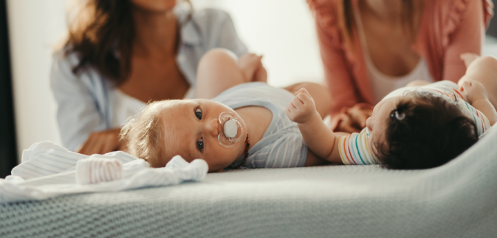 Two women with two babies