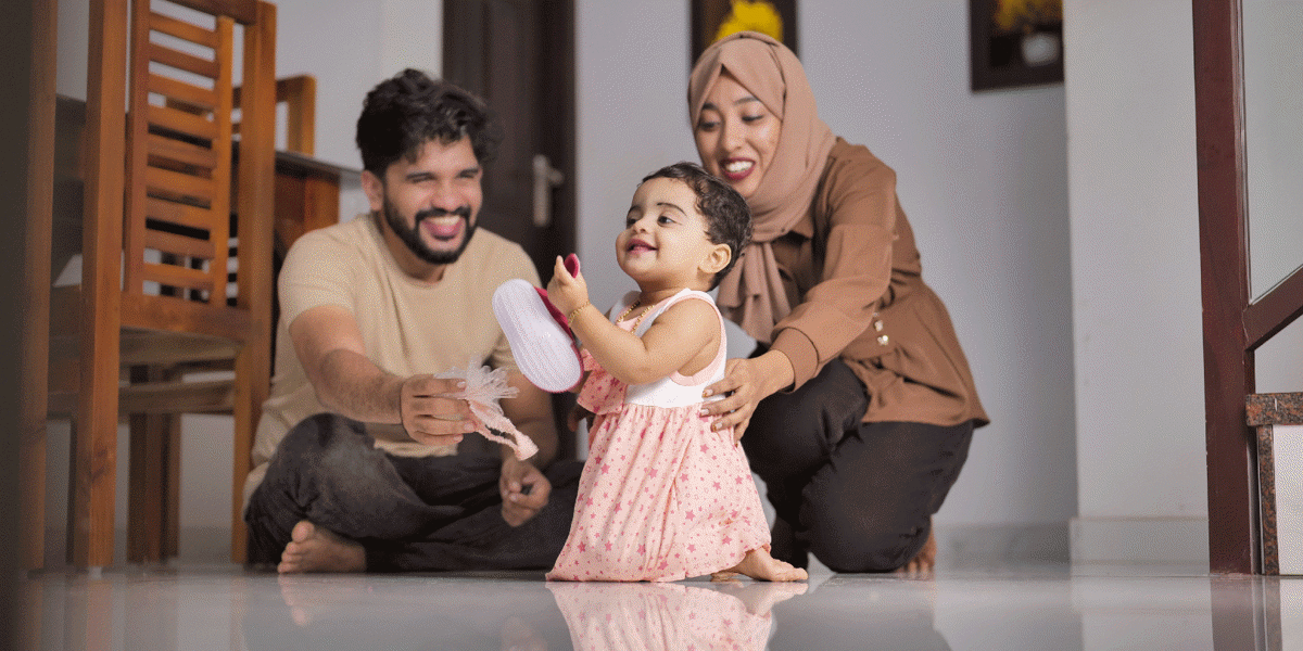 Happy Indian Muslim Family with little Daughter at Home