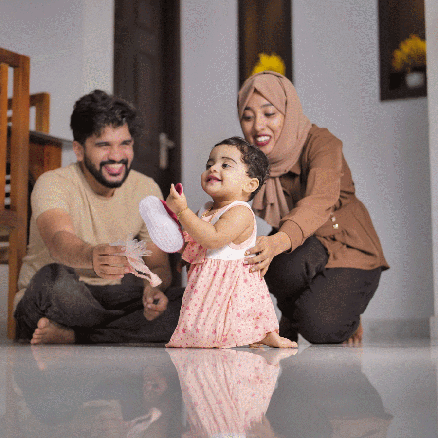 Happy Indian Muslim Family with little Daughter at Home