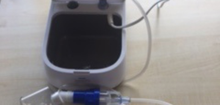 A nebuliser laying open on a table