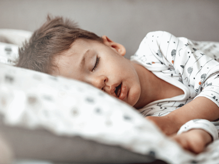 boy sleeping in his bed