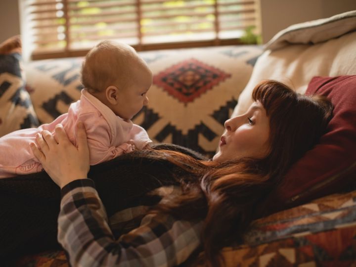 Mother Playing With Her Baby Sofa