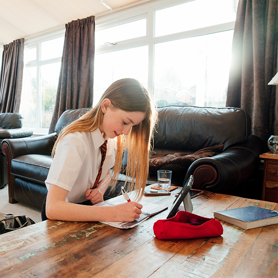 Girl doing schoolwork at home